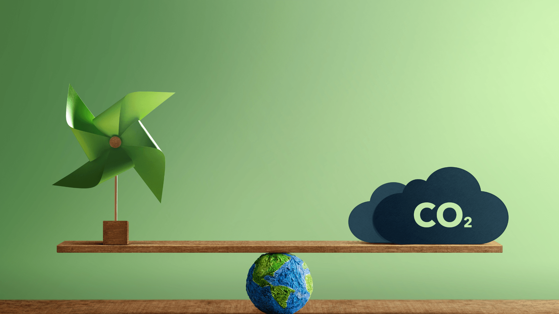 this image shows a balance between how reduced emissions and increased use of renewable energy can balance carbon footprint.